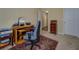 Office space with a desk, chair, shelving, and overhead lighting at 110 Baltusrol Way, Covington, GA 30014