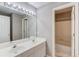 Neutral bathroom features a double sink vanity and a tub and shower combo at 1721 Crowes Lake Ct, Lawrenceville, GA 30043