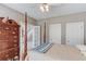 Charming bedroom featuring a four-poster bed, light wood floors, and a vintage-style dresser at 1721 Crowes Lake Ct, Lawrenceville, GA 30043