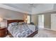 Comfortable bedroom with natural light, a ceiling fan, and an ensuite bathroom at 1721 Crowes Lake Ct, Lawrenceville, GA 30043