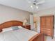 Cozy bedroom featuring a wooden bed frame and furniture with stairway access at 1721 Crowes Lake Ct, Lawrenceville, GA 30043