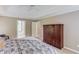 Bedroom with large armoire and view of en suite bathroom at 1721 Crowes Lake Ct, Lawrenceville, GA 30043