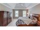 Spacious bedroom features a tray ceiling, and ample storage at 1721 Crowes Lake Ct, Lawrenceville, GA 30043
