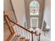 Bright foyer with a staircase, a large window, and chandelier at 1721 Crowes Lake Ct, Lawrenceville, GA 30043