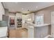 Modern kitchen featuring stainless steel appliances, white cabinetry, and a peninsula counter with sink at 1721 Crowes Lake Ct, Lawrenceville, GA 30043