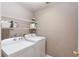 Laundry room featuring a washing machine, a dryer, and wire shelving at 1721 Crowes Lake Ct, Lawrenceville, GA 30043