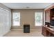 Bright office space featuring two windows and a dark wooden desk with a storage cabinet at 1721 Crowes Lake Ct, Lawrenceville, GA 30043
