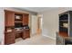 Office space featuring an attached desk with cabinetry and a black bookshelf at 1721 Crowes Lake Ct, Lawrenceville, GA 30043