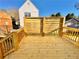 New wooden back deck with privacy screen, perfect for outdoor entertaining at 2535 Impala Dr, Cumming, GA 30041