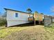 Exterior view of the home showcasing the backyard and new wooden deck at 2535 Impala Dr, Cumming, GA 30041