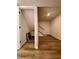 View of basement featuring hardwood floors and an unfinished storage area under the stairs at 2535 Impala Dr, Cumming, GA 30041