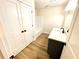Renovated bathroom with dual closets, stylish vanity, and modern shower and tub at 2535 Impala Dr, Cumming, GA 30041