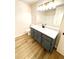 Modern bathroom with shaker cabinet vanity, white countertop, and new flooring at 2535 Impala Dr, Cumming, GA 30041