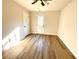 Bedroom featuring hardwood floors and a back door to a private yard at 2535 Impala Dr, Cumming, GA 30041