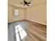 View of bedroom featuring hardwood floors, a white back door, and a ceiling fan at 2535 Impala Dr, Cumming, GA 30041