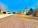 Newly renovated home with a long driveway and lush front yard at 2535 Impala Dr, Cumming, GA 30041