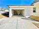 Attached garage with shelving and a concrete driveway, providing ample parking and storage at 2535 Impala Dr, Cumming, GA 30041