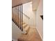 Carpeted staircase with railing and wood slats with natural lighting at 2535 Impala Dr, Cumming, GA 30041