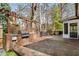Outdoor kitchen with stainless grill, brickwork, and pergola covered deck, ideal for gatherings at 2955 Rhodenhaven Nw Dr, Atlanta, GA 30327
