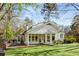 Gorgeous backyard with lush lawn, bay windows, and screened in porch for enjoying outdoor living at 2955 Rhodenhaven Nw Dr, Atlanta, GA 30327