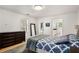 Bright bedroom featuring a walk-in closet, ensuite bathroom, and hardwood floors at 2955 Rhodenhaven Nw Dr, Atlanta, GA 30327