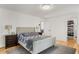 Cozy bedroom with hardwood floors, a gray rug, and a well-organized walk-in closet at 2955 Rhodenhaven Nw Dr, Atlanta, GA 30327
