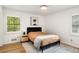 Cozy bedroom featuring hardwood floors, and large bright window with great natural light at 2955 Rhodenhaven Nw Dr, Atlanta, GA 30327