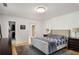 Bedroom view showcasing hardwood floors, walk-in closet and a connected full bathroom at 2955 Rhodenhaven Nw Dr, Atlanta, GA 30327