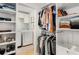 Well-organized walk-in closet with custom shelving, hanging rods and a laundry at 2955 Rhodenhaven Nw Dr, Atlanta, GA 30327