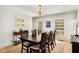 Spacious dining room with natural light, dark wood table, and neutral decor at 2955 Rhodenhaven Nw Dr, Atlanta, GA 30327