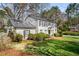 Well-maintained home with a beautiful lawn, mature trees, and classic architectural details at 2955 Rhodenhaven Nw Dr, Atlanta, GA 30327