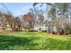 Two-story home with a spacious lawn and mature trees, offering a serene setting at 2955 Rhodenhaven Nw Dr, Atlanta, GA 30327