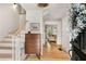 Inviting foyer with hardwood floors, a staircase, and views into the living area at 2955 Rhodenhaven Nw Dr, Atlanta, GA 30327