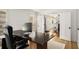 Well-lit home office space with a large desk and views of the hallway at 2955 Rhodenhaven Nw Dr, Atlanta, GA 30327