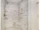 Updated shower stall featuring white tile, built-in shelves, and modern fixtures at 2955 Rhodenhaven Nw Dr, Atlanta, GA 30327