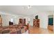 Bright bedroom with wood floors, bookshelf, television, ceiling fan, and connected to a bathroom at 475 Cascade Rise, South Fulton, GA 30331