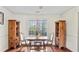 Bright dining room featuring hardwood floors, natural light, and classic wooden furniture at 475 Cascade Rise, South Fulton, GA 30331