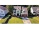 Aerial view of the charming home with well-manicured front lawn and red garage doors at 475 Cascade Rise, South Fulton, GA 30331