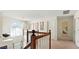 Upstairs hallway with chandelier, large window, and neutral carpet at 475 Cascade Rise, South Fulton, GA 30331