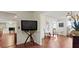 Open-concept living area with hardwood floors seamlessly connecting different spaces in the home at 475 Cascade Rise, South Fulton, GA 30331
