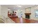 Spacious living room with fireplace, open floorplan, hardwood floors, and outdoor access at 475 Cascade Rise, South Fulton, GA 30331