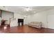 Spacious living room with hardwood floors, white walls, and stairs to the second story at 475 Cascade Rise, South Fulton, GA 30331