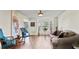 Open living room with hardwood floors, decorative bay windows and stylish furnishings at 475 Cascade Rise, South Fulton, GA 30331
