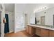 Main bathroom featuring double vanity sinks, a large mirror, and a walk-in shower at 475 Cascade Rise, South Fulton, GA 30331
