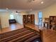 Spacious main bedroom with hardwood floors, built-in bookshelves, and a seating area at 475 Cascade Rise, South Fulton, GA 30331