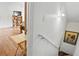 Staircase to the basement with hardwood floors, and white walls at 475 Cascade Rise, South Fulton, GA 30331