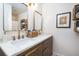 Bathroom featuring double vanity, marble countertops, and brushed gold fixtures at 666 Serramonte Drive Dr, Marietta, GA 30068
