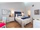 Bedroom features a queen bed, wood floors, and plenty of natural light at 666 Serramonte Drive Dr, Marietta, GA 30068
