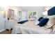 Cozy bedroom features a queen bed, wood floors, and natural lighting at 666 Serramonte Drive Dr, Marietta, GA 30068