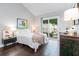 Bright bedroom features a queen bed, hardwood floors, and sliding glass door to patio at 666 Serramonte Drive Dr, Marietta, GA 30068